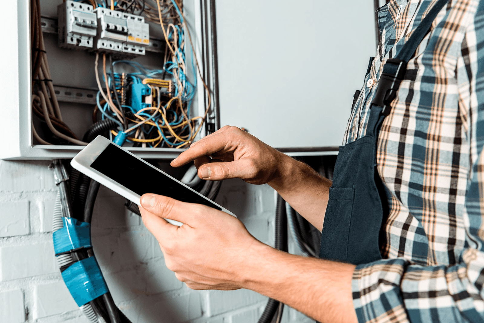 Technician verifying a unit circuit on a tablet